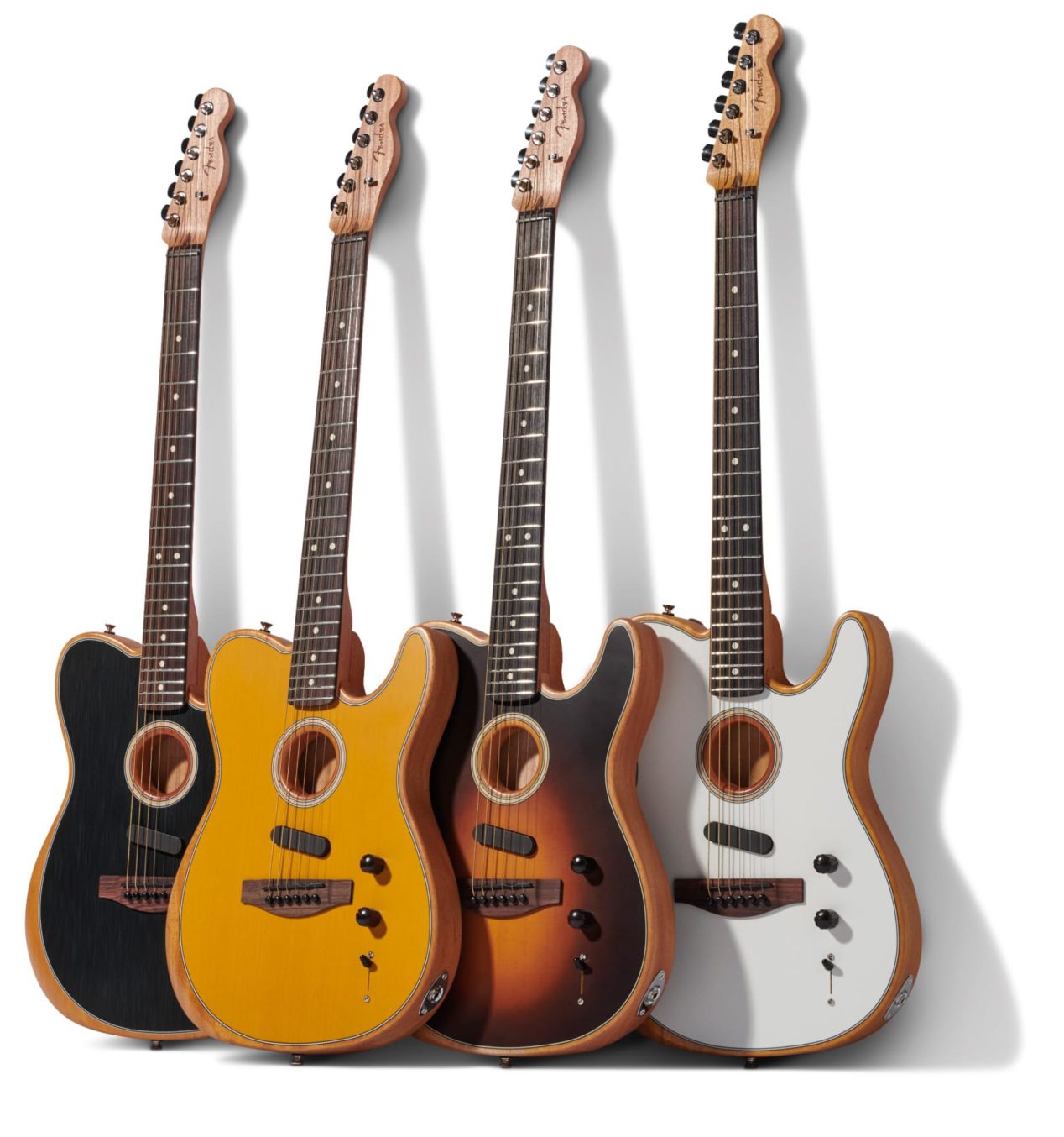 Photo of a multiple Acoustasonic guitars against a white background.