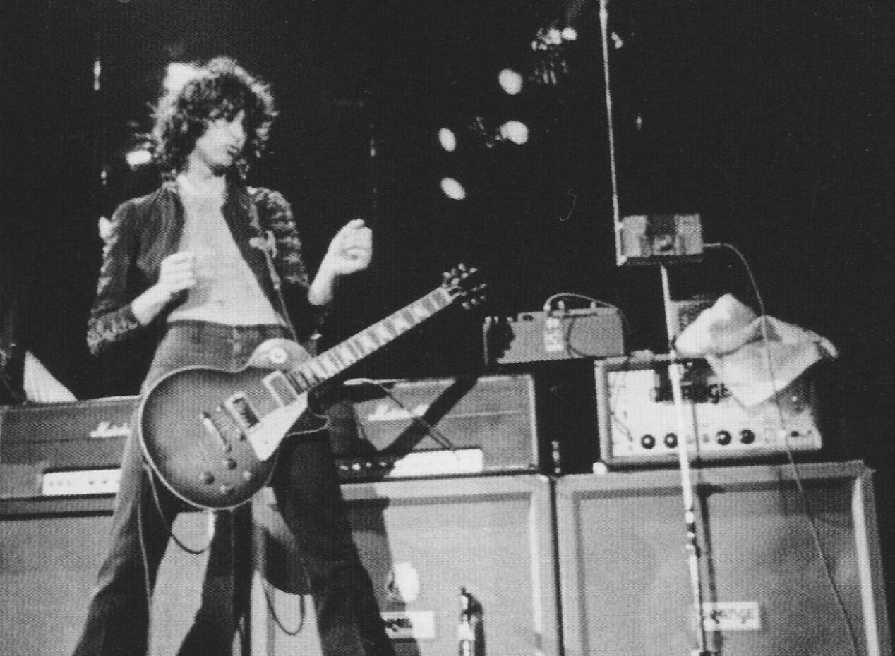 Jimmy Page Playing in front of Orange Amps & cabinets